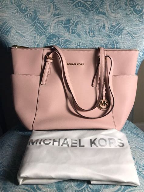 litlle mark on my soft pink michael kors purse